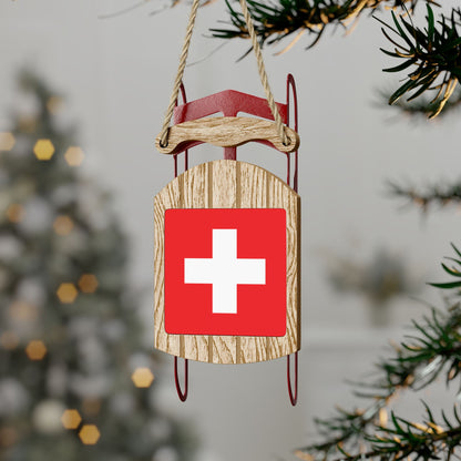 Wooden sled ornament featuring Swiss flag, perfect for Swiss-themed Christmas decor. Perfect gift