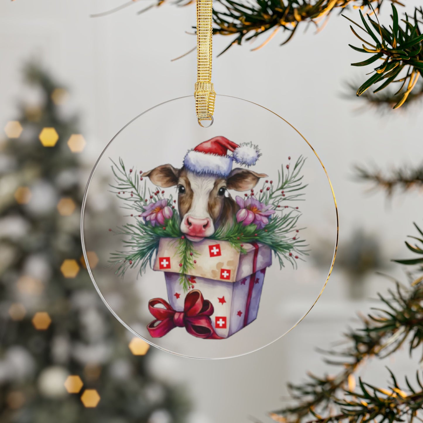 "Acrylic ornament featuring cow in Santa hat with Swiss-inspired holiday deco