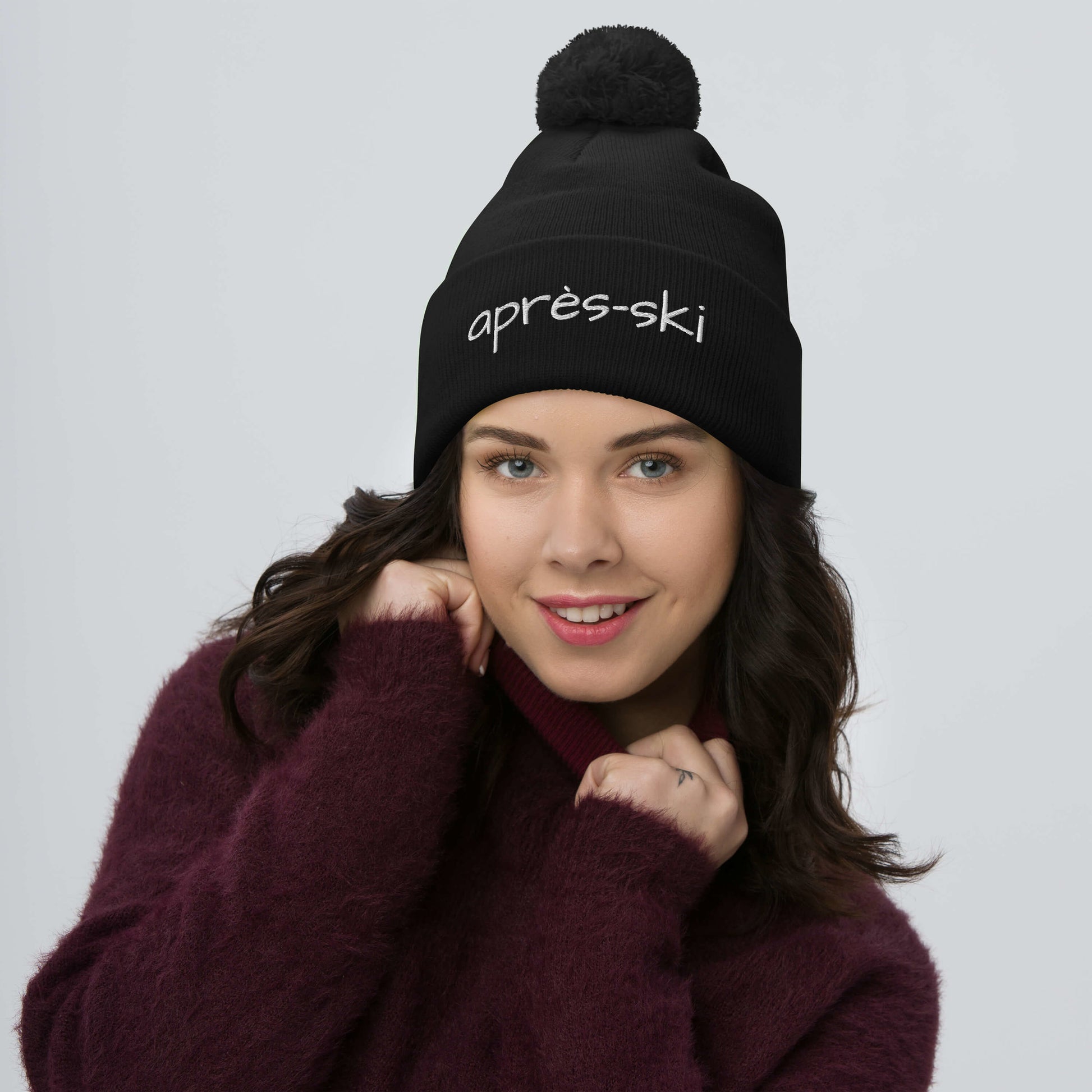 Cozy après-ski pom-pom beanie with embroidered text