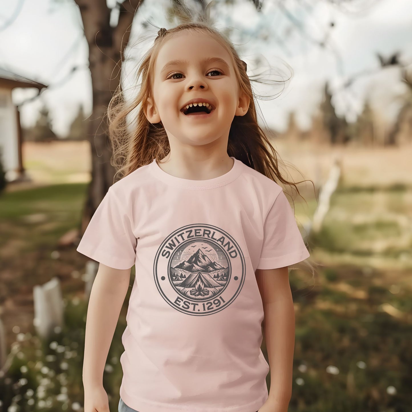 Toddler wearing a Switzerland SINCE 1291-themed t-shirt outdoors