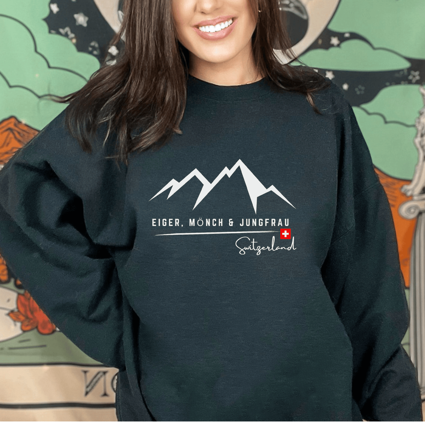 Sweatshirt featuring the minimalist Swiss Alps skyline design with Eiger, Mönch & Jungfrau peaks and Swiss flag, available in our online souvenir store