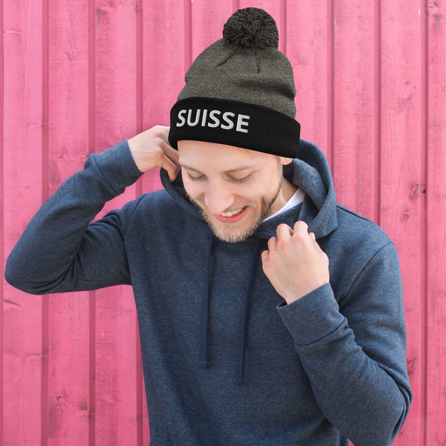 Alps-inspired Switzerland pom-pom hat with bold embroidered text ⛰️🇨🇭